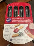 Wilton Spoons Pan Makes 8 - New But Paper Wrap Has Wear. Fixed Price $11.00.