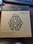 New Pampered Chef Round-up From The Heart 2011 Cast Metal Trivet Copper Top. Fixed Price $7.99.