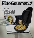 Elite Gourmet EOM123 Mini Omelette Maker, Black, 360W Nonstick Portable. Fixed Price $24.99.