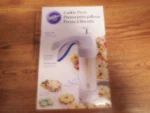 Wilton Simple Success Cookie Press 13-PIECE Looks Unused Zat. Fixed Price $8.00.