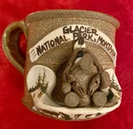 Glacier National Park Montana Stoneware Souvenir Cup 3.5 X. Fixed Price $5.00.