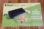 New Foodsaver Fm 2100-000 Vacuum Sealing System With Starter Kit Free Shipping. Fixed Price $99.00.