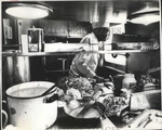 1975 Press Photo Chef Tony Rudd Cooks Stainless Steel Kitchen - MJB46264. Fixed Price $23.88.