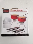 Oggi 8 Piece Seafood Set Shellfish Warmers, Forks, Crackers, Etc New. Fixed Price $34.95.
