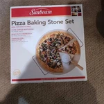 Sunbeam Pizza Baking Stone Set With Rack And Cutter-new Box. Fixed Price $25.99.