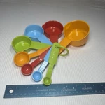 Rainbow Measuring Cups And Spoons Set. Fixed Price $9.96.