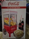 Nostalgia-electrics Coca-cola 12-CUP Hot Popcorn Maker Swirling Airflow. Fixed Price $34.95.