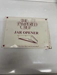 The Pampered Chef Jar Opener White/gray # 2675 Box. Fixed Price $15.99.