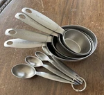 Oneida Stainless Steel Measuring Cups 4 Pieces + Spoons Set. Fixed Price $35.00.