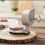 Lem Spring Loaded Burger Press. Fixed Price $30.00.