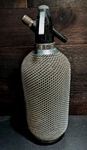 Vintage Isi Classic Soda Siphon Seltzer Bottle Wire Metal Mesh Cocktail Maker. Fixed Price $39.00.