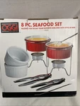 Oggi 8 Piece Seafood Set Shellfish Warmers, Forks, Crackers Nice!. Fixed Price $14.99.