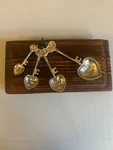 Ganz 4 Piece Silvertone Metal Measuring Spoon Set Keys Love. Fixed Price $8.50.