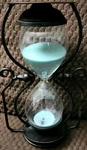 Black Metal Green Sand Filled Hourglass Rotating Timer Urban Decor 10.5" X 6.5". Fixed Price $29.99.
