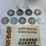 Wear Ever Super Shooter Cookie Press Part Disk Disc Set Of 9 Book #70123. Fixed Price $17.86.
