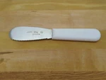Choice 7.25" Scalloped Sandwich Spreader With White Composite Plastic Handle. Fixed Price $10.00.