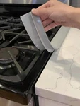 1PC Silicone Oil-proof Sealing Tape Kitchen Stove Cover. Fixed Price $12.00.